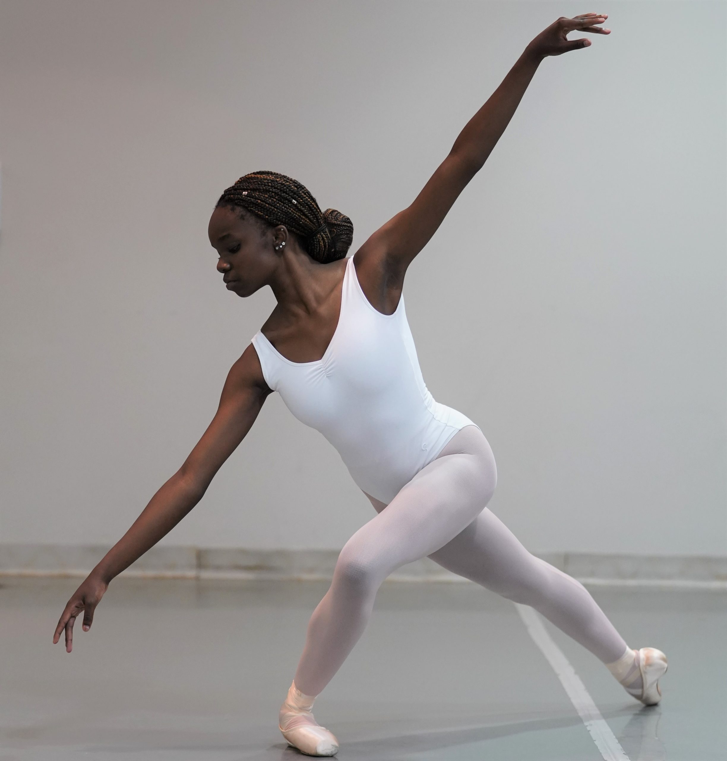 Dancer in studio in a dynamic pose.